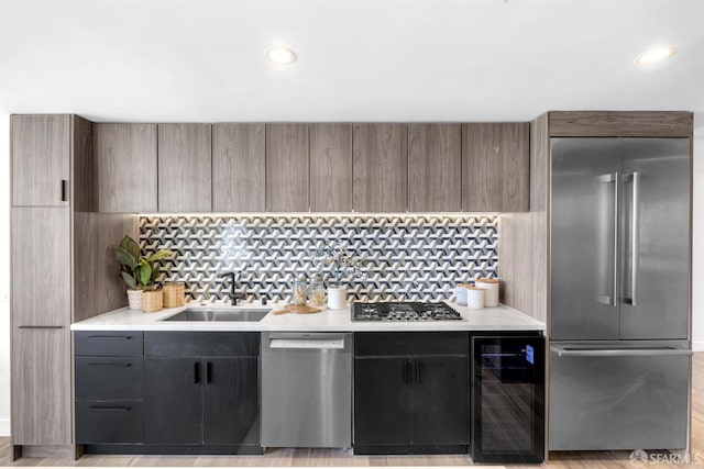 555 Fulton St Unit 519, San Francisco, CA 94102 - kitchen with stainless steel appliances, beverage cooler, light countertops, a sink, and modern cabinets