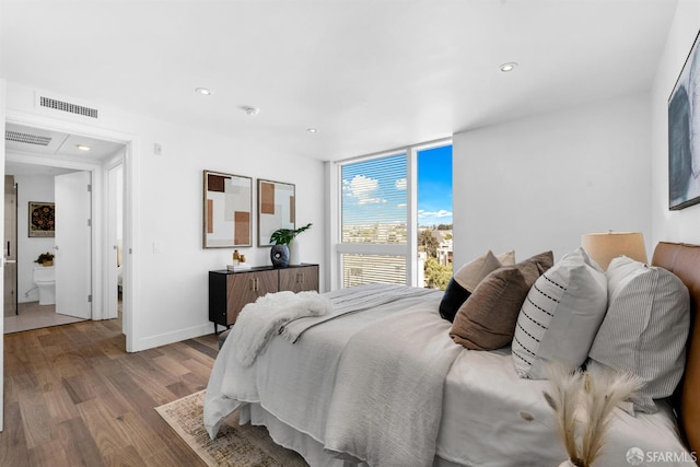 555 Fulton St Unit 519, San Francisco, CA 94102 - bedroom featuring wood finished floors, recessed lighting, baseboards, and expansive windows
