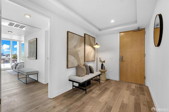 555 Fulton St Unit 519, San Francisco, CA 94102 - hallway featuring light wood finished floors, baseboards, a raised ceiling, and recessed lighting