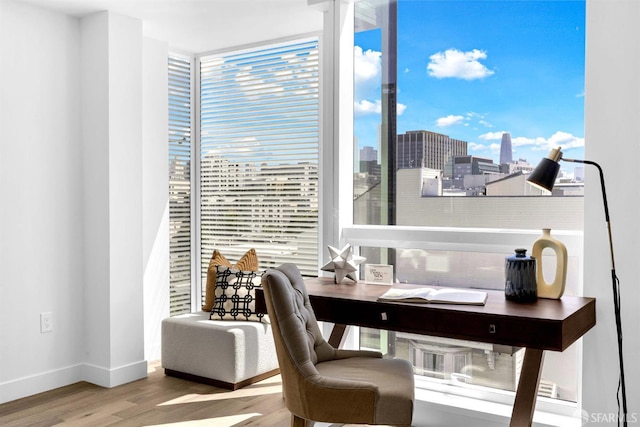 555 Fulton St Unit 519, San Francisco, CA 94102 - home office with wood finished floors, plenty of natural light, baseboards, and floor to ceiling windows