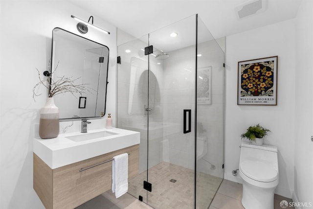 555 Fulton St Unit 519, San Francisco, CA 94102 - bathroom with toilet, vanity, a stall shower, tile patterned floors, and recessed lighting