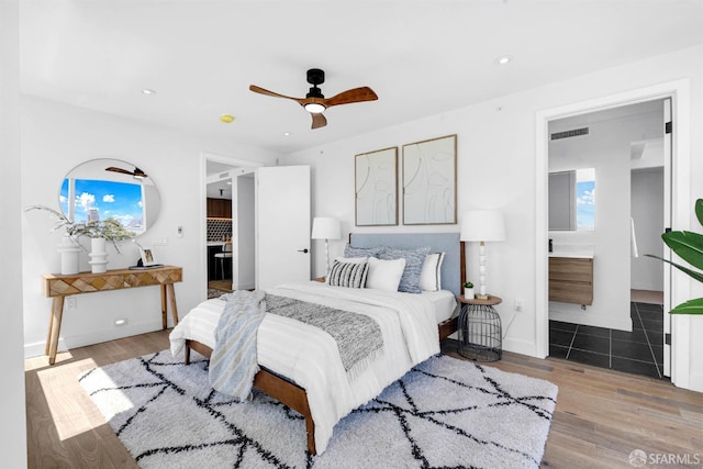 555 Fulton St Unit 519, San Francisco, CA 94102 - bedroom with light wood finished floors, recessed lighting, ensuite bath, ceiling fan, and baseboards