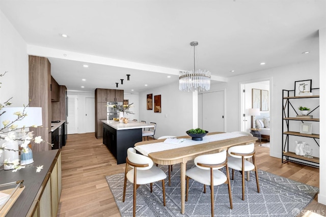 555 Fulton St Unit 519, San Francisco, CA 94102 - dining room featuring light wood finished floors, recessed lighting, and a chandelier