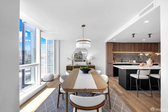 555 Fulton St Unit 519, San Francisco, CA 94102 - dining space with light wood-style flooring, recessed lighting, and a chandelier
