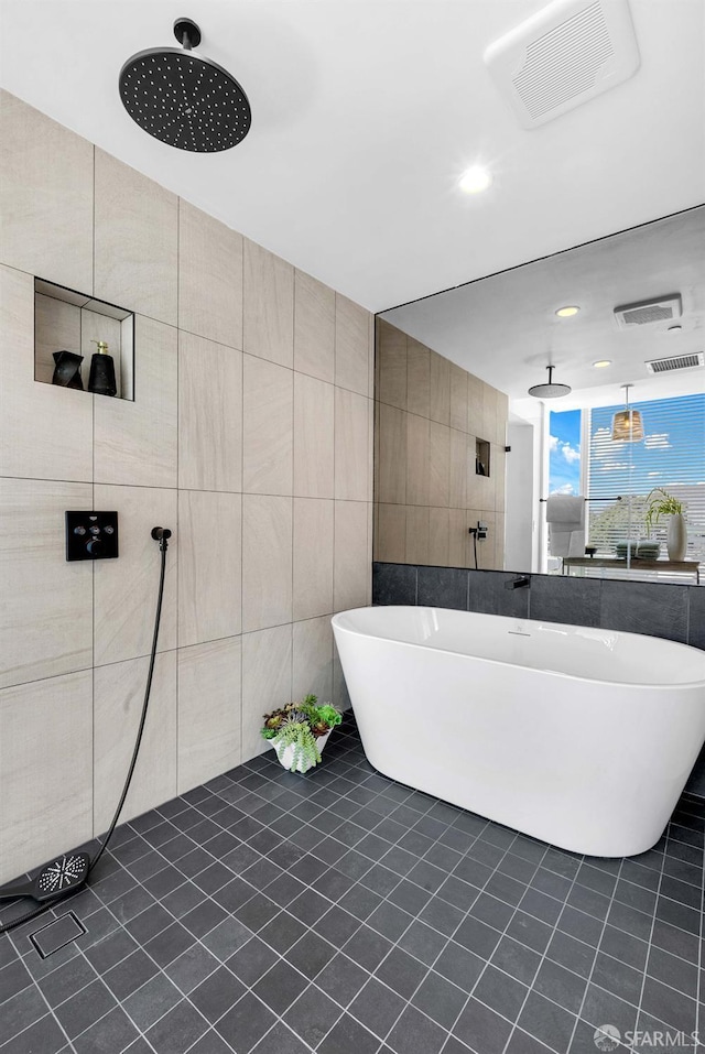 555 Fulton St Unit 519, San Francisco, CA 94102 - full bathroom with tile patterned flooring, a freestanding bath, recessed lighting, tile walls, and tiled shower