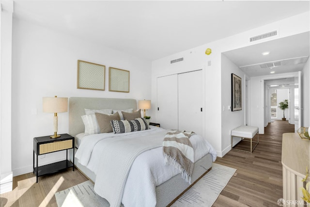 555 Fulton St Unit 519, San Francisco, CA 94102 - bedroom featuring a closet, wood finished floors, and baseboards