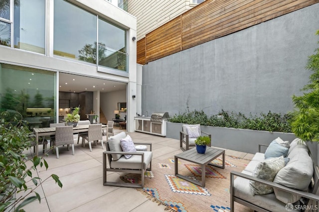 view of patio / terrace featuring area for grilling and outdoor lounge area