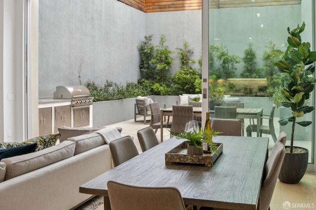 view of patio with an outdoor kitchen, a grill, and outdoor lounge area