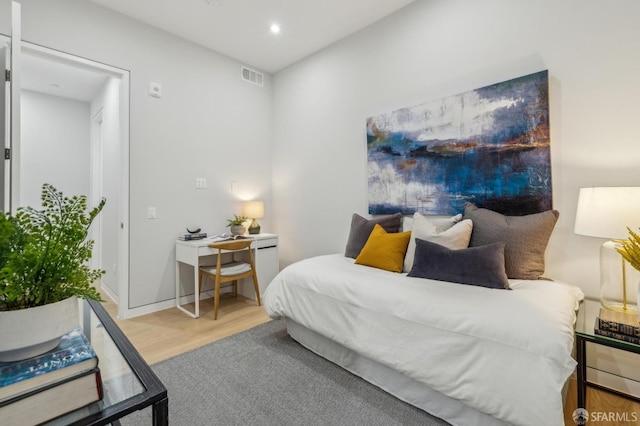 bedroom with wood-type flooring