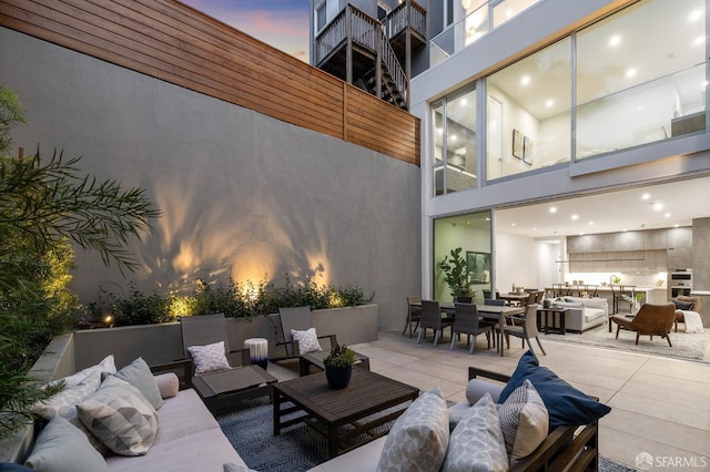 patio terrace at dusk with an outdoor hangout area