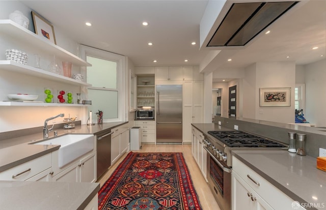 kitchen with open shelves, high quality appliances, a sink, white cabinetry, and recessed lighting