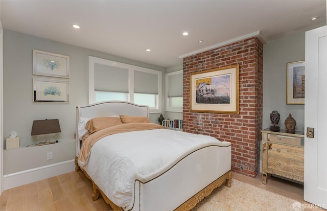 bedroom featuring light wood finished floors, baseboards, and recessed lighting