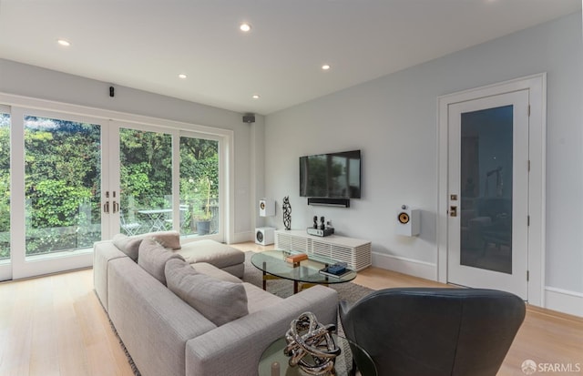 living room featuring recessed lighting and light wood finished floors