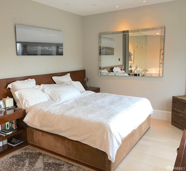 bedroom with recessed lighting and baseboards