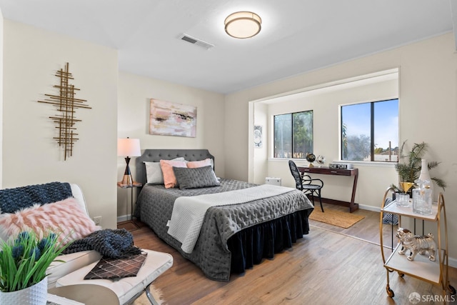 bedroom featuring wood-type flooring