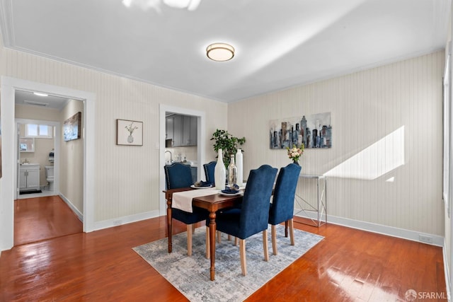 dining area with wood-type flooring