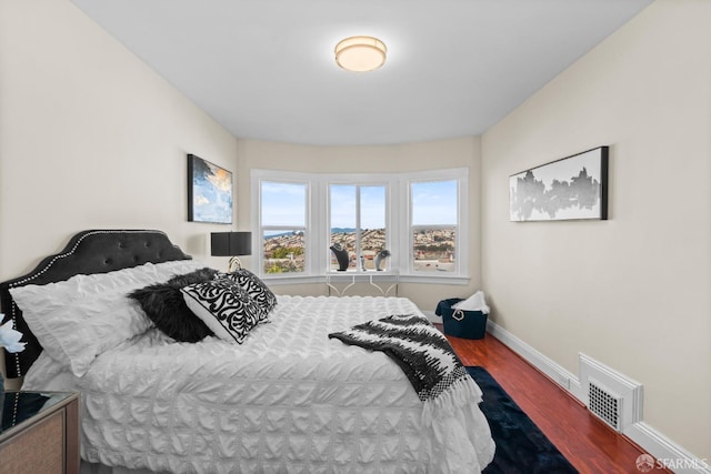 bedroom featuring dark hardwood / wood-style floors