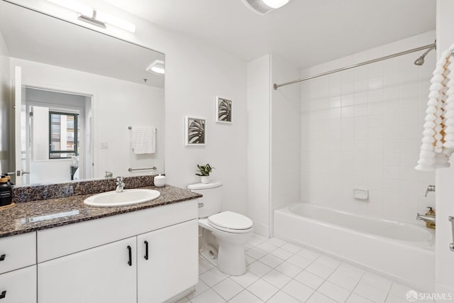 full bathroom with vanity, toilet, tile patterned floors, and tiled shower / bath combo