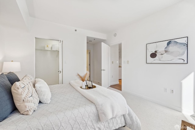 carpeted bedroom featuring a closet