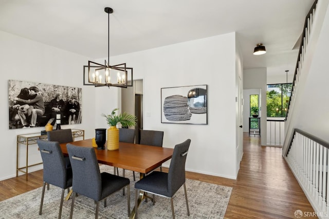 112 S Lake Merced Hls, San Francisco, CA 94132 - dining room with wood finished floors, a chandelier, and baseboards