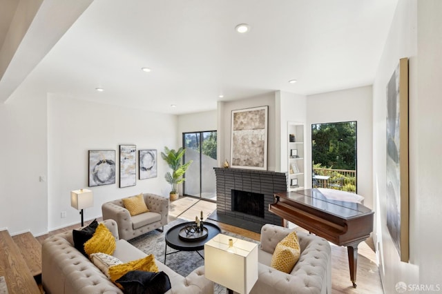 112 S Lake Merced Hls, San Francisco, CA 94132 - living area with plenty of natural light, light wood-type flooring, a brick fireplace, recessed lighting, and baseboards