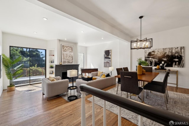 112 S Lake Merced Hls, San Francisco, CA 94132 - dining area with a chandelier, light wood-type flooring, recessed lighting, and a brick fireplace