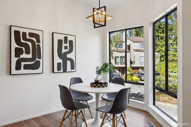 112 S Lake Merced Hls, San Francisco, CA 94132 - dining area featuring a chandelier, wood finished floors, and baseboards