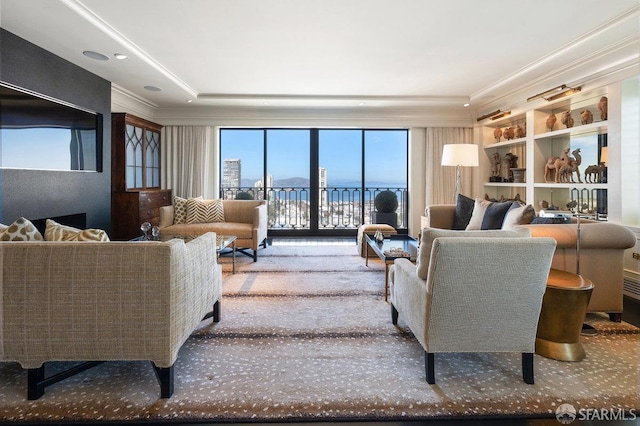 carpeted living room featuring ornamental molding and a water view