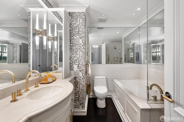 full bathroom featuring toilet, vanity, crown molding, and plus walk in shower