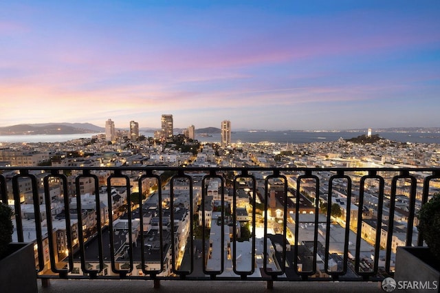 view of balcony at dusk