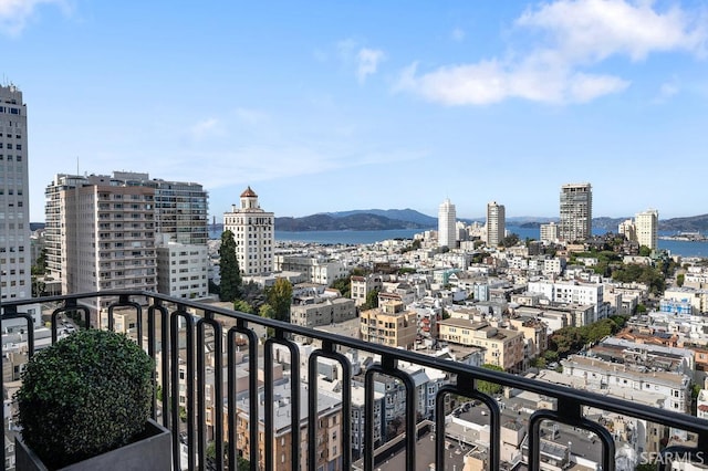 balcony with a water and mountain view