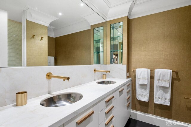 bathroom featuring tile walls, vanity, ornamental molding, and tasteful backsplash