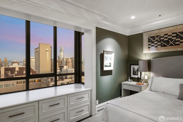 bedroom featuring multiple windows and crown molding