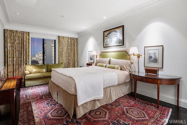 bedroom featuring dark wood-type flooring and ornamental molding