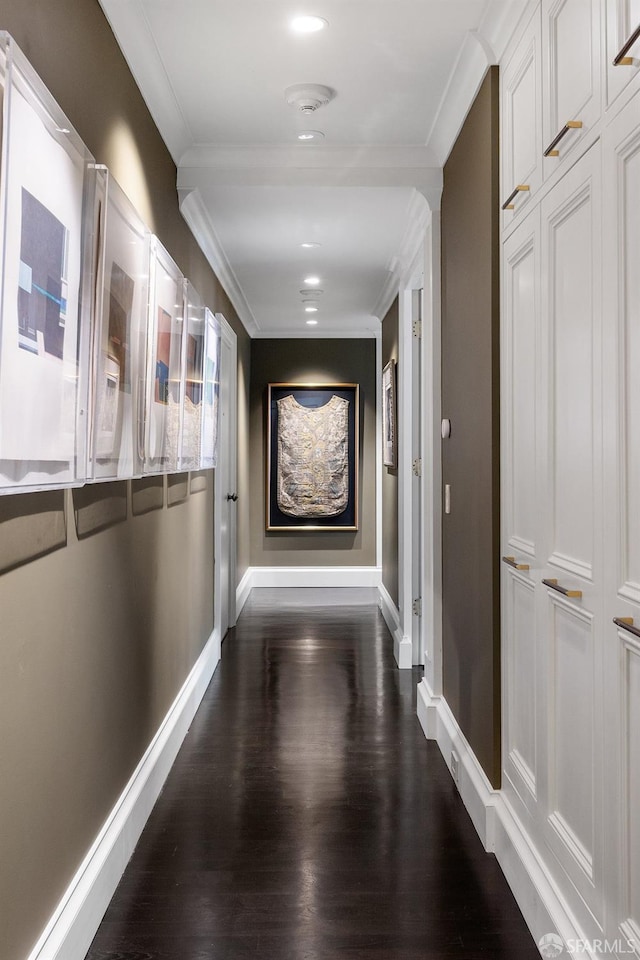 corridor with crown molding and dark hardwood / wood-style floors