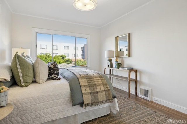232 Talbert St, San Francisco, CA 94134 - bedroom featuring wood finished floors, baseboards, and crown molding