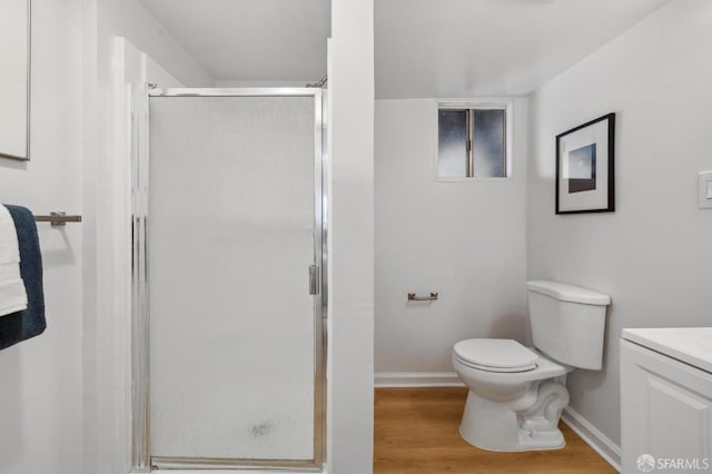 232 Talbert St, San Francisco, CA 94134 - bathroom featuring baseboards, toilet, a shower stall, vanity, and wood finished floors