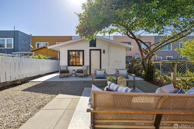 232 Talbert St, San Francisco, CA 94134 - back of property featuring a patio area, fence, and outdoor lounge area