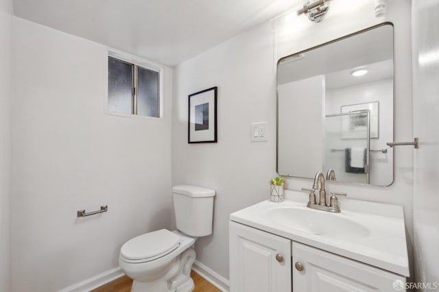 232 Talbert St, San Francisco, CA 94134 - bathroom with toilet, baseboards, vanity, and wood finished floors