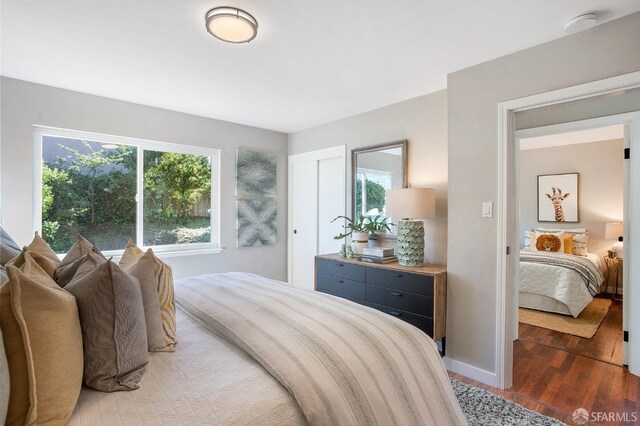 bedroom featuring light wood-type flooring and baseboards