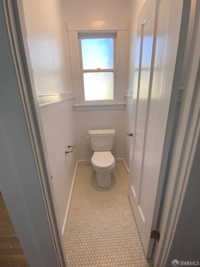 bathroom with tile patterned floors and toilet