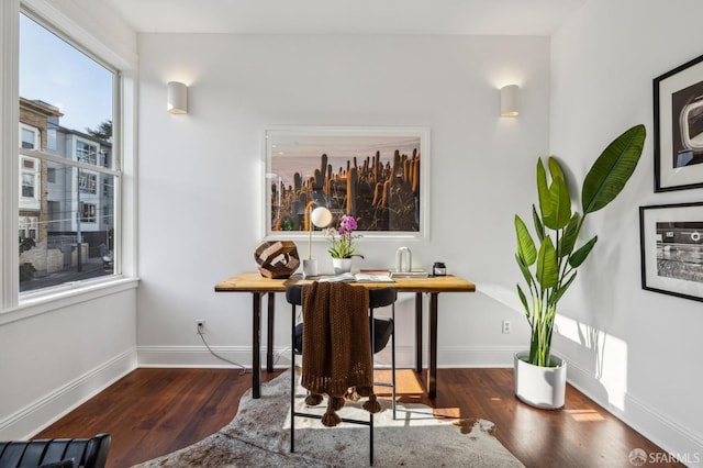 dining area featuring dark hardwood / wood-style floors