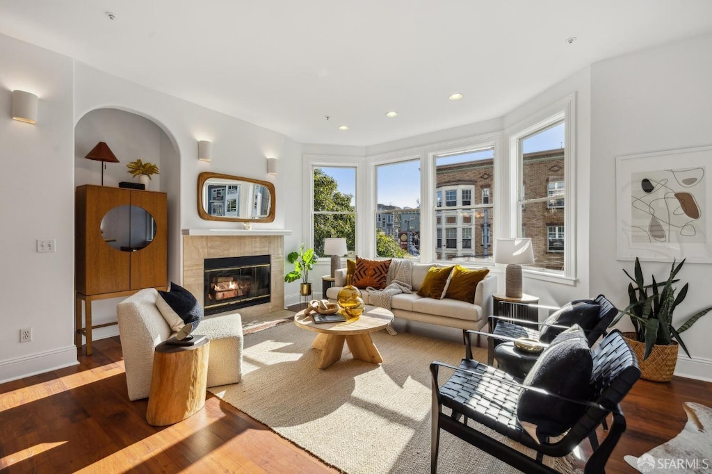 living room featuring dark hardwood / wood-style floors and a fireplace