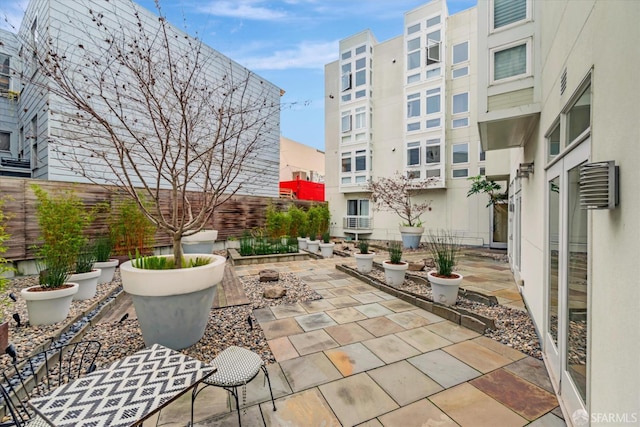 view of patio featuring fence