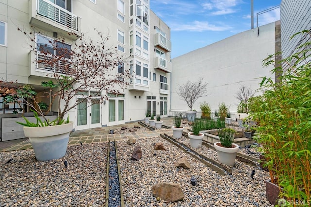 surrounding community with a patio area, a garden, and fence