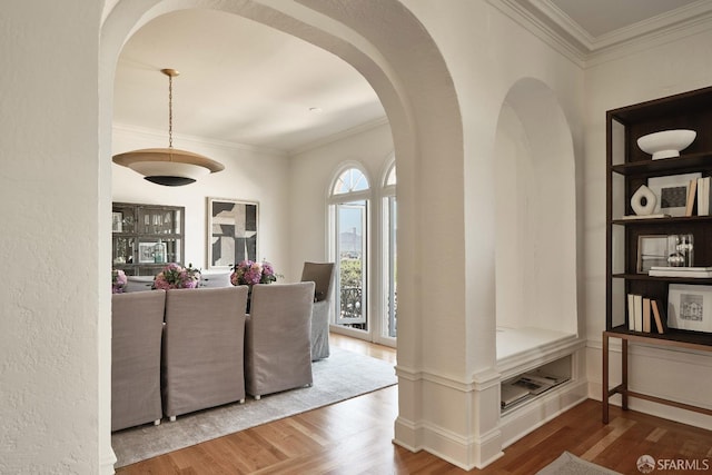 living room featuring ornamental molding and hardwood / wood-style floors