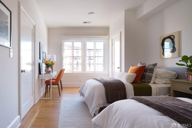 bedroom with light hardwood / wood-style floors