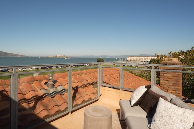 balcony featuring a water view