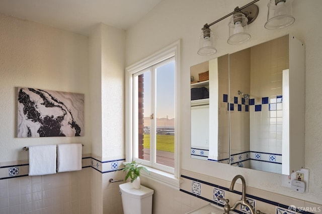 kitchen with tile walls and a wealth of natural light