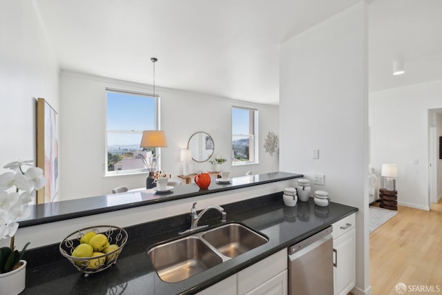 355 Buena Vista E Avenue 605W, San Francisco, CA 94117 - kitchen featuring dark countertops, white cabinetry, a sink, light wood finished floors, and dishwasher